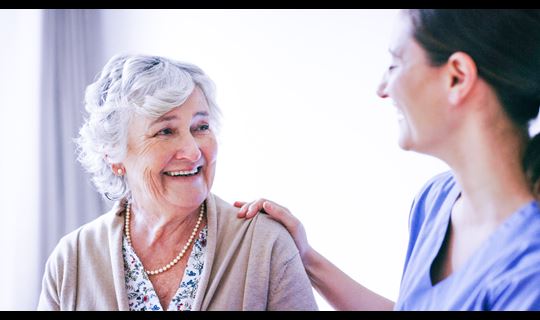 Elderly female pt and nurse_GettyImages-1165979798